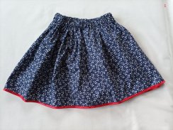 Dětská sukně - lístečky na modrém podkladu